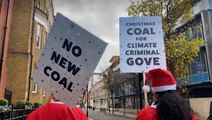 Campaigners deliver sacks of coal to Michael Gove's office after decision on Cumbria mine