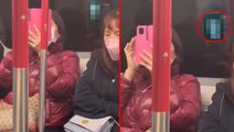 Metroda cinsel içerikli film izleyen kadını camdaki yansıma ele verdi