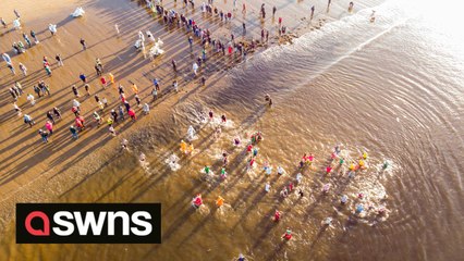 Drone footage captures people taking part in the annual South Shields Boxing Day Dip