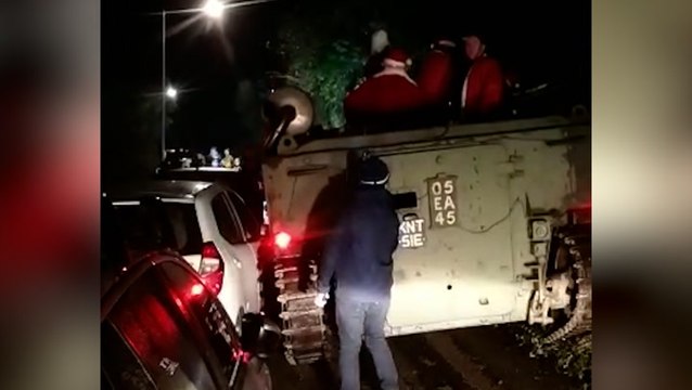 Pub-crawling Santas block Cornish road after getting army tank stuck in hedge