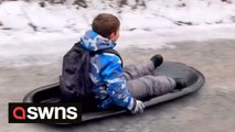 Mum and kids forced to SLEDGE to school after icy conditions made using the car impossible