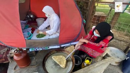 street food in Afghanistan woman working in Afghanistan street food