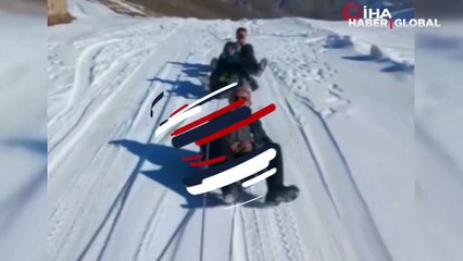 70 yaşındaki dedenin karda kızak keyfi izleyenleri güldürdü