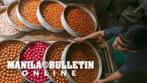 Workers of a Puto't kutsinta production site show preparation of the Filipino delicacy for the upcoming new year