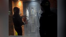 Police chainsaw cocaine dealer's door during drug bust