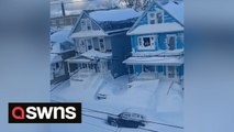 Footage shows Buffalo neighborhood buried under blanket of snow with vehicles parked almost completely covered