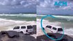 4WD gone wrong: Driver bogged before almost getting wiped out by waves