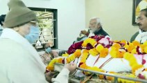 Pm modi carries tha mortal remains of his late mother  Heeraben Modi