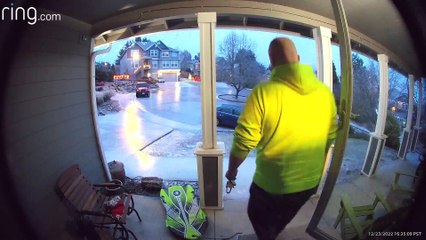Man Slides Down Sidewalk After Ice Storm