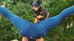 Athletic German Pinscher impresses with a cool jump over upside-down hooman