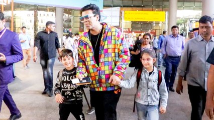 Karan Johar Cutely Holding His Twins At Airport!