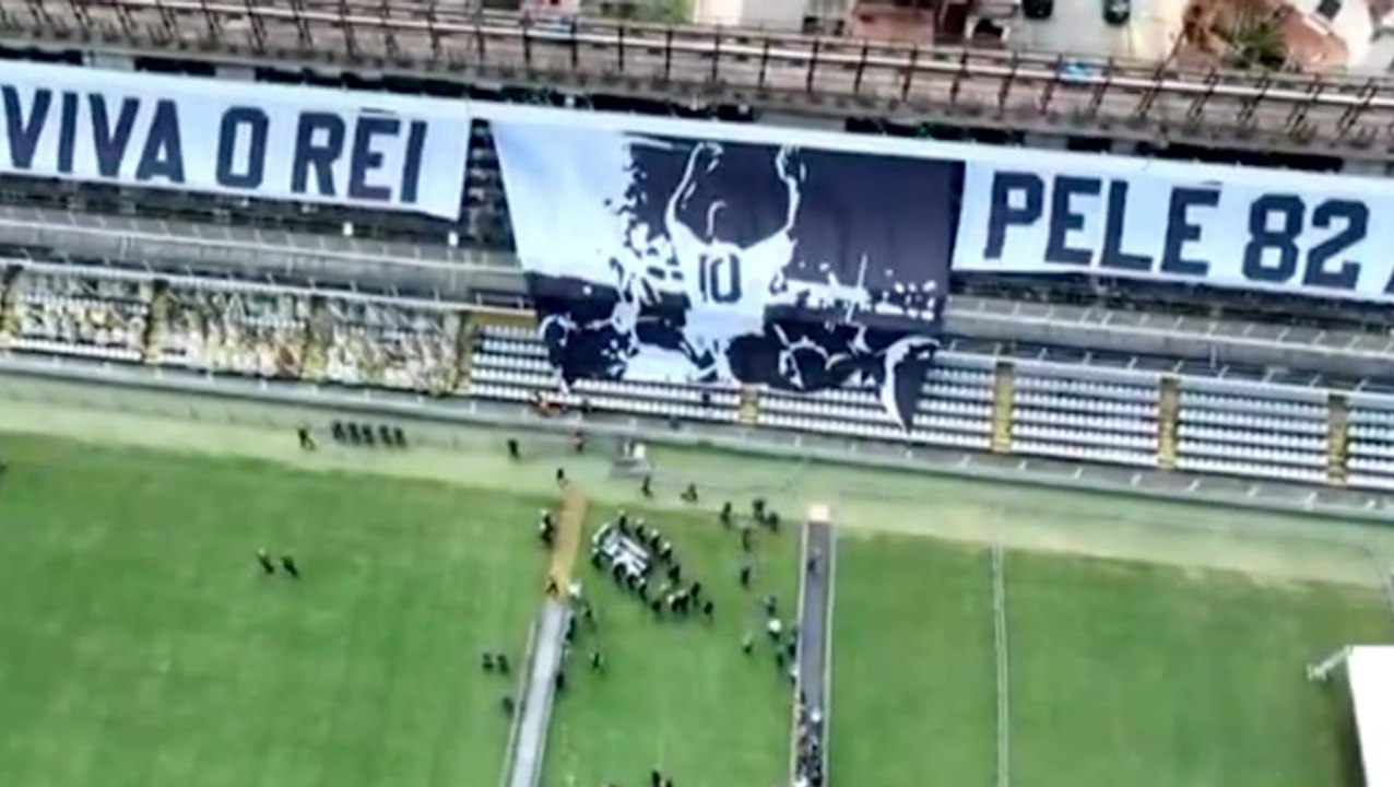 Pele’s coffin carried out of Santos’ stadium by soldiers ahead of funeral procession