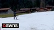 Skiers struggle to hit the slopes in the Alps after minimal snowfall renders the resorts barren