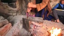 Baking Potatoes in Foil under Charcoal Villagers in Iran