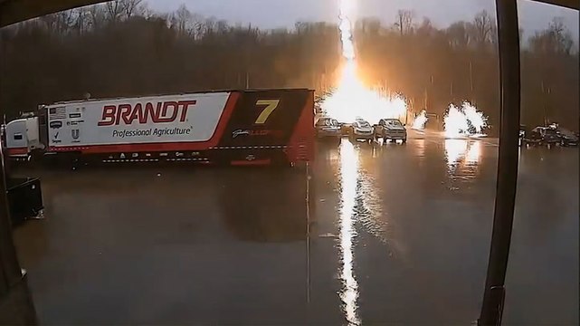 Crazy moment lightning bolt strikes parked truck, sending sparks flying across car park