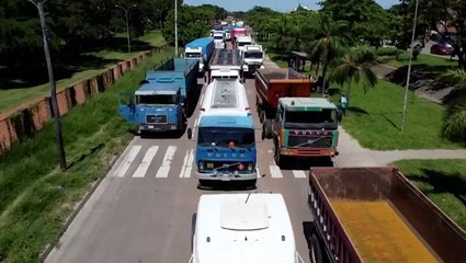 Hundreds of Bolivian protesters in trucks block highway after arrest of opposition leader