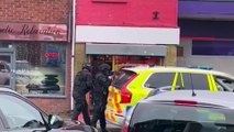 NEW: Police called to 'suspicious' incident outside bank