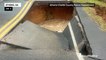 Giant sinkhole swallows car after heavy rain in Georgia