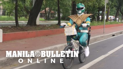 Man in a Power Rangers Green Ranger costume spotted on his way to see the Black Nazarene image