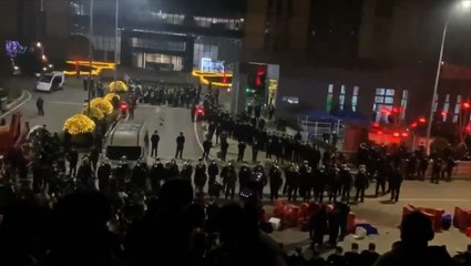 China: Workers making Covid test kits clash with police at factory