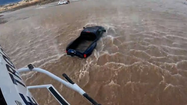 Driver rescued from submerged car by helicopter after ignoring Arizona flood warnings