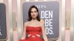 Lily James Stunned on the 2023 Golden Globes Carpet in a Voluminous Red Cut-Out Gown