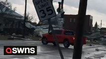 Buildings destroyed and debris strewn on roads after tornado sweeps through Alabama