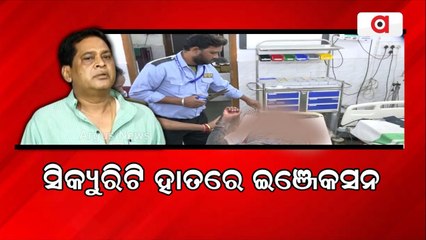 Security Guard Giving Injection to Patient