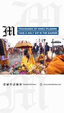 Thousands of Hindu pilgrims take a holy dip in the Ganges