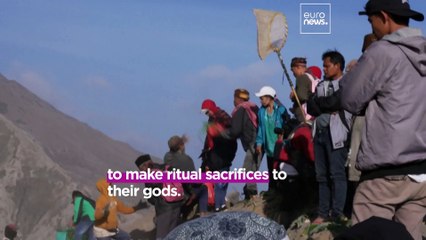Thousands are offering ritual sacrifices on an active volcano in Indonesia