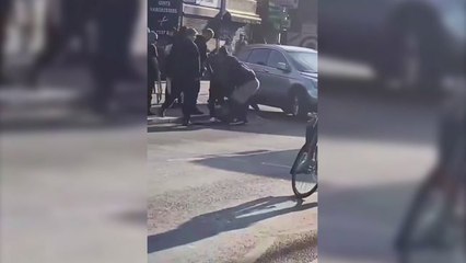 Man arrested after reports of broken bottle attack on woman and child in The Blue