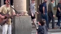 Street performer's impromptu collab with excited kid shows that music unites all