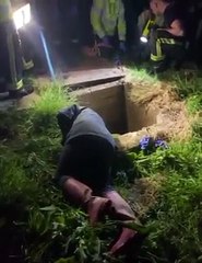 Jack Russell dog terrier is rescued from sewer pipe