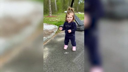 Adorable toddler 'obsessed' with her big brother waits for him to get off the school bus everyday