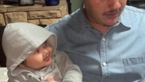 'Nobody is gonna know' - Sneaky baby lets her fingers go for a swim in daddy's drink