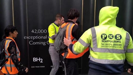 Just Stop Oil protester pinned to wall as bystanders push group off road