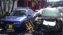 Carros abandonados en la capital son removidos con maquinaria