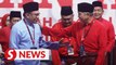 ‘Old friend’ Anwar receives standing ovation at Umno big meet