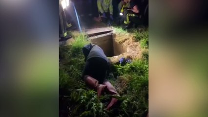 Video shows the moment a woman was reunited with her dog after it spent seven hours trapped - in a sewer pipe
