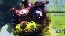 Malaysian aquarium holds underwater lion dance for Lunar New Year