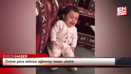 Önüne para atılınca ağlamayı kesen ufaklık