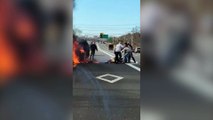 Heroic bystanders stop traffic to rescue 56-year-old woman from fireball after car sets alight on New York highway