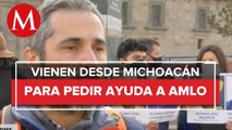 Protestan en el Zócalo CdMx familiares de dos personas desaparecidas en Michoacán
