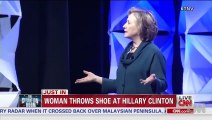 Watch Hillary Clinton dodge a shoe on stage