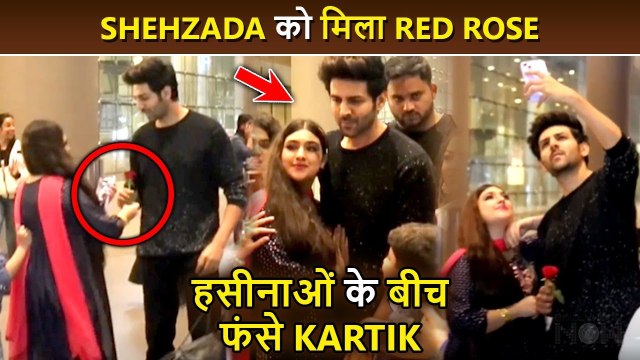 A Crazy Female Fan Gives Beautiful Red Rose To Kartik Aaryan, Gets Cozy With Him At Airport