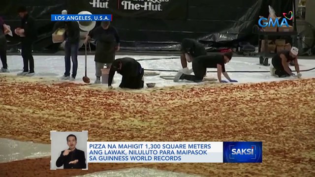 Pizza na mahigit 1,300 square meters ang lawak, niluluto para maipasok sa Guinness World Records | Saksi