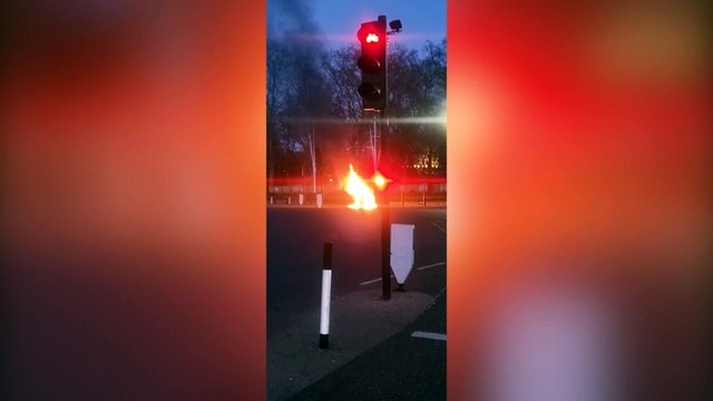 Footage shows a car engulfed in flames outside Buckingham Palace