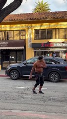 Wild Man Punching and Climbing on Cars Gets Arrested