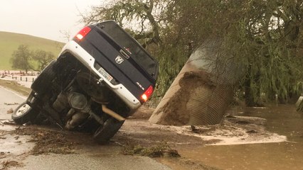 California floods: Car NEARLY eaten up by a sinkhole in Paso Robles *CHILLING shot*