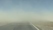 Vehicle Drives Through Sandstorm With Low Visibility in Pahrump, Nevada